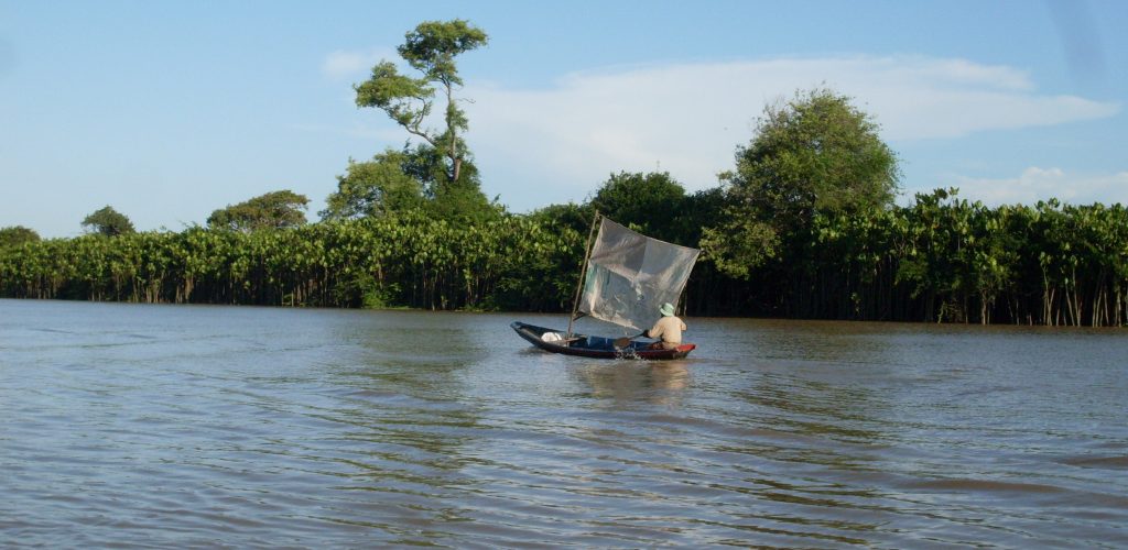 A small jangada sails down the river Preguiças. 