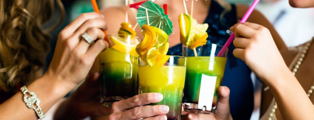 Several friends sip on colorful cocktails in Pipa. 