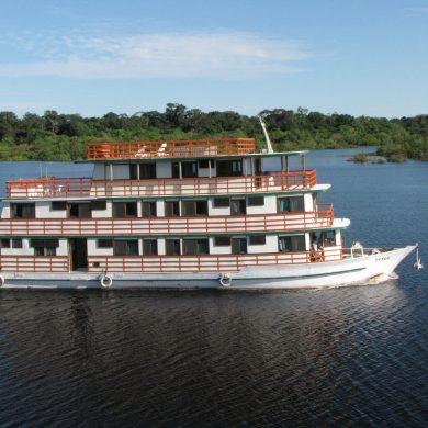 A private ship cruises along the Rio Negro.