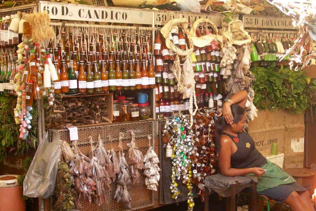 Woman sits at her stall at the ver o peso market in Belem.