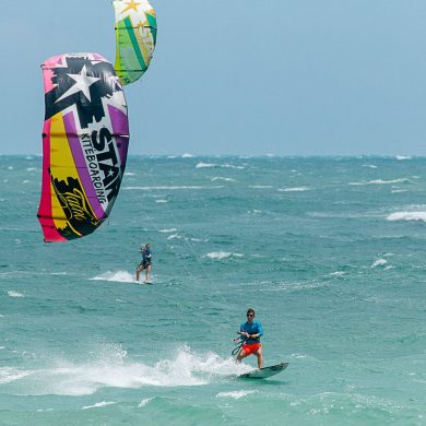 Kitesurfer surfs a surf board in Natal.