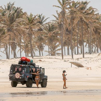 Kitesurfers load up their jeep on the beach in Brazil.