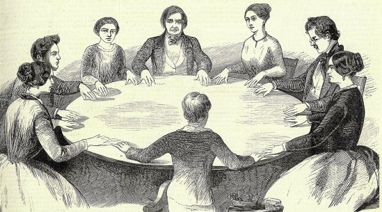 Pencil drawing of people around a round table practicing spiritism.